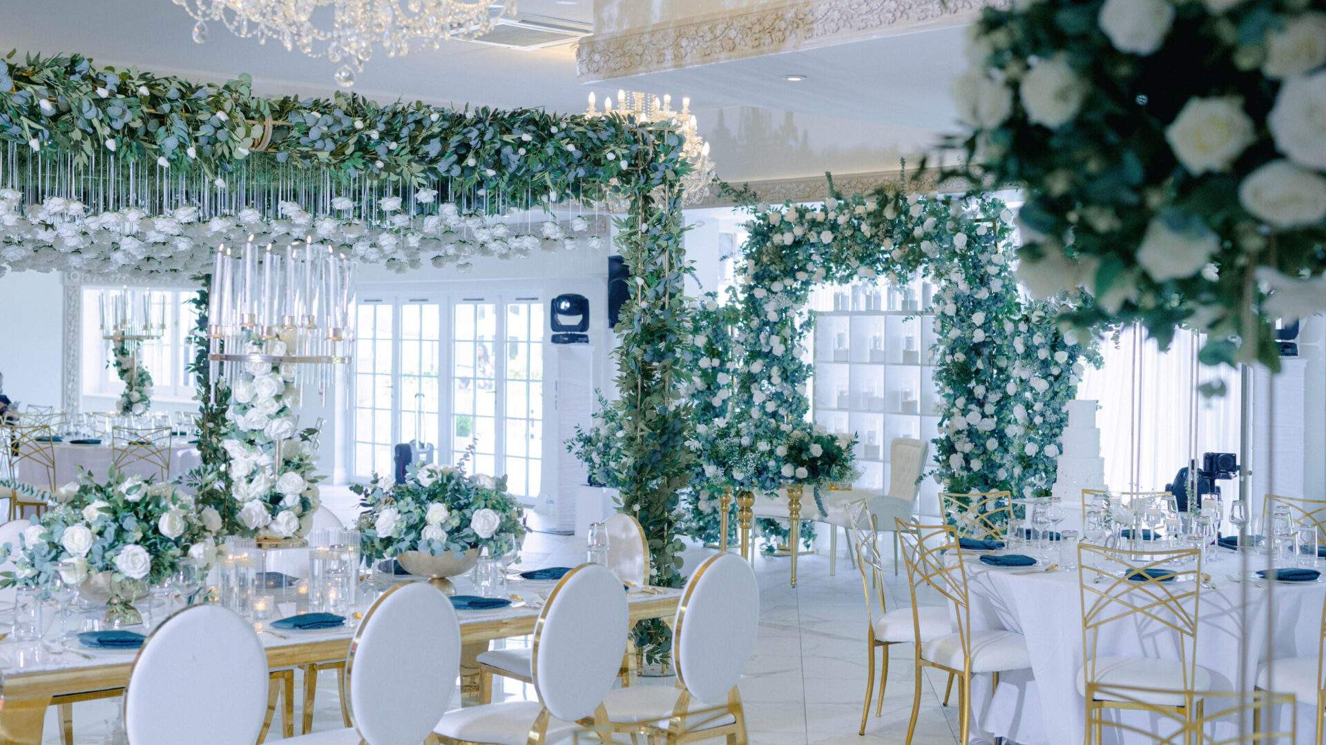 Froyle Park's Grand Ballroom is the perfect space for a large African Wedding Reception, with the ability to host up to 300 guests in a bright space overlooking our beautiful gardens. This setup was done by Victor Rose and features hanging greenery.