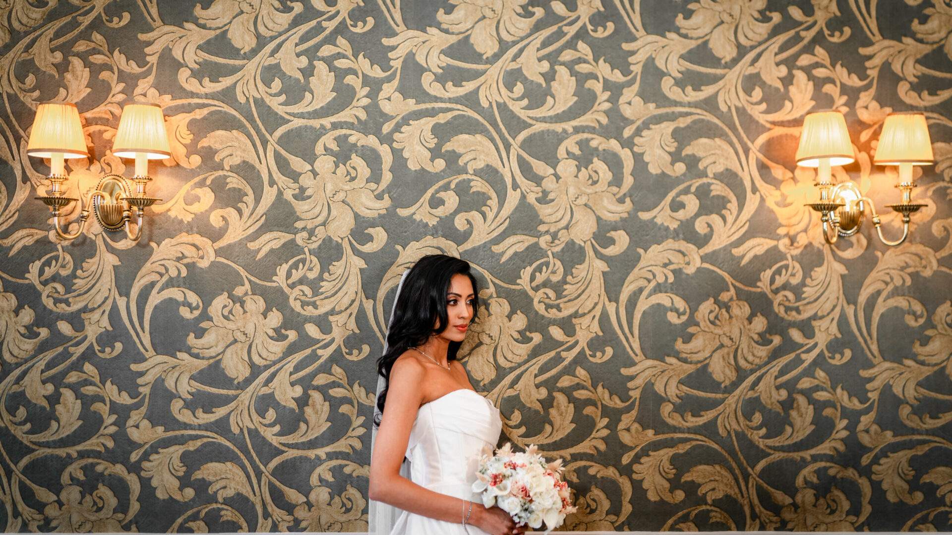 An Asian Bride posing for a photo inside our stunning Morning Room at Froyle Park.