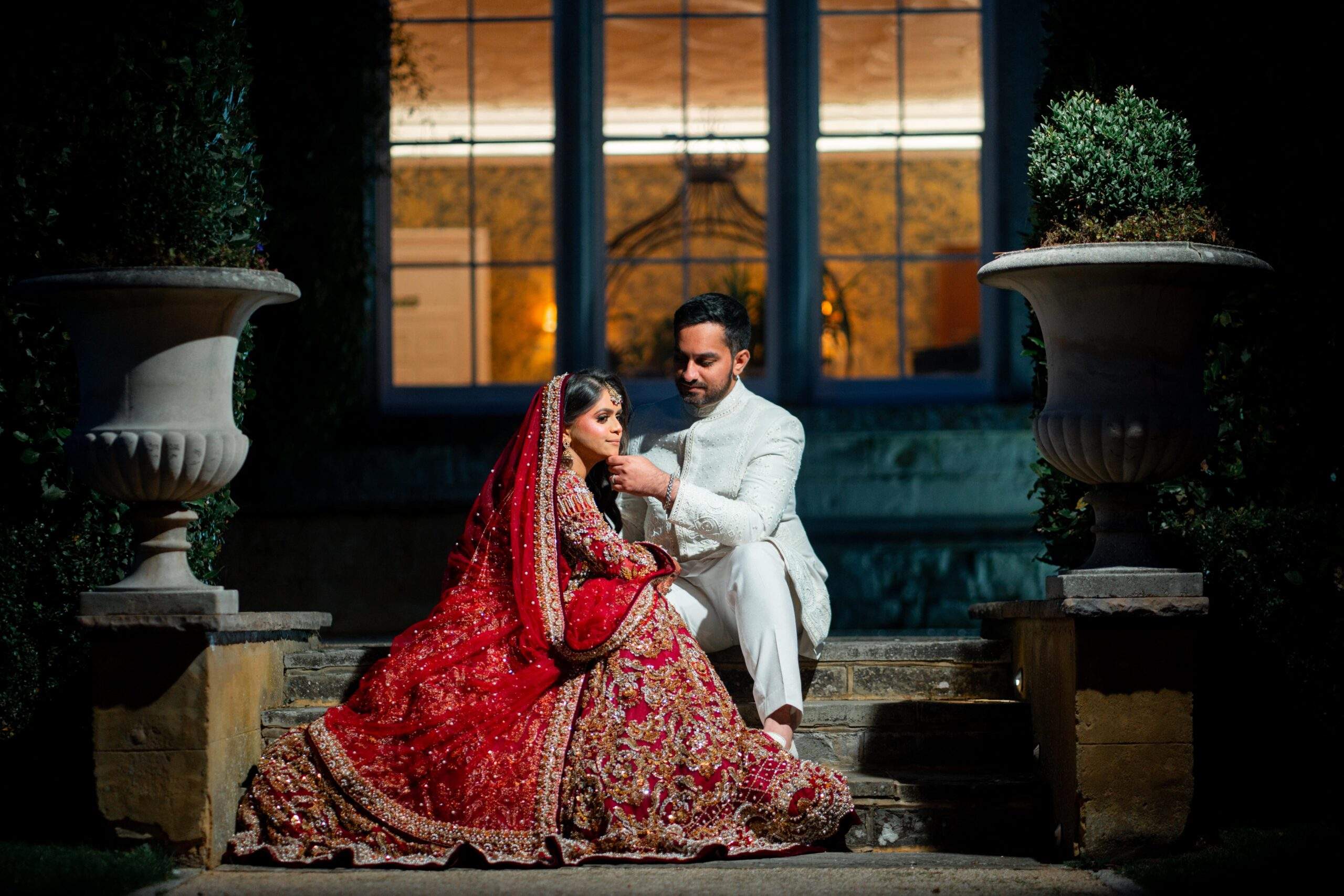 A Pakistani Muslim Bride & Groom, dressed in cultural outfits, celebrating their wedding in the grounds of Froyle Park, Surrey.