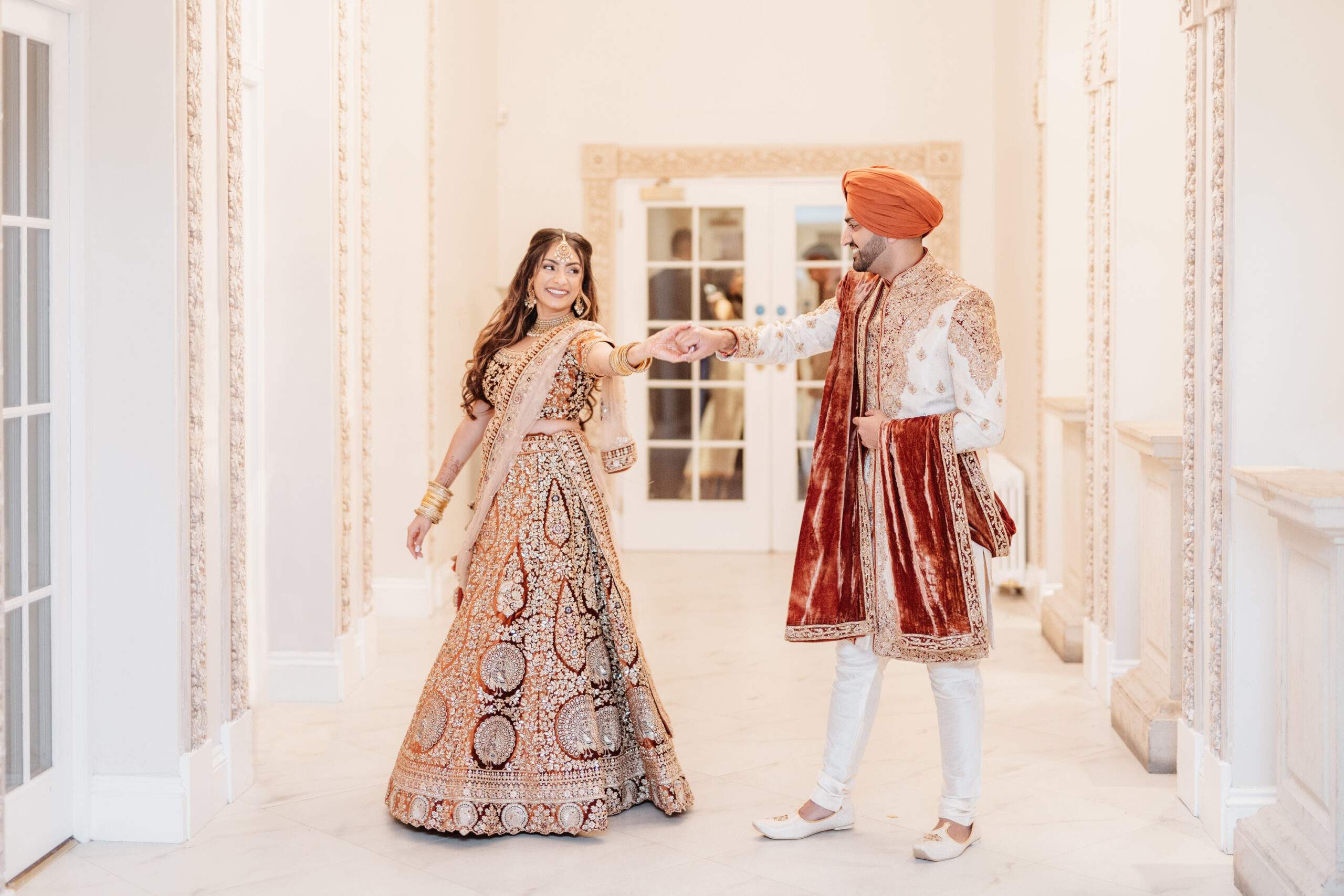 Sikh Bride & Groom enjoying a special moment before walking into their wedding reception.