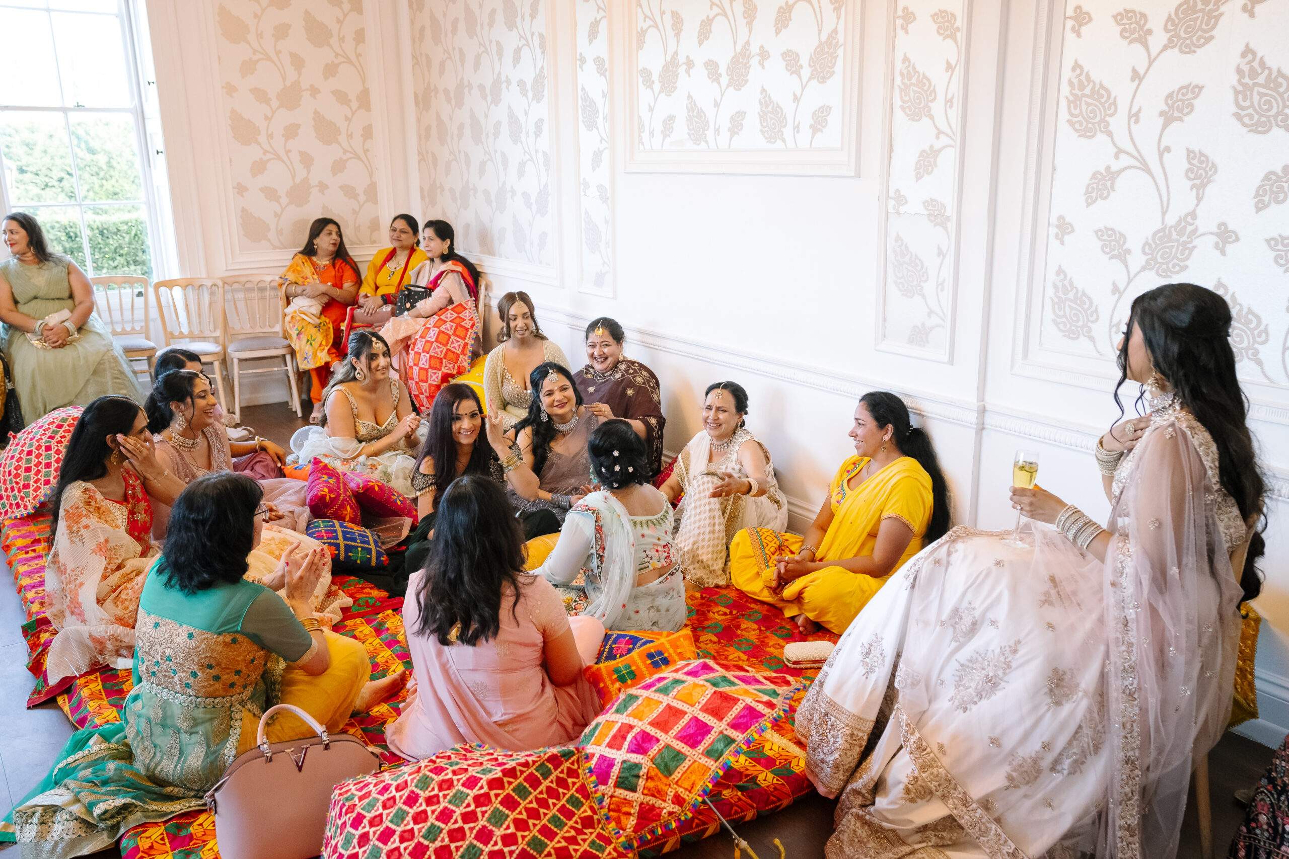 A colourful Mehndi taking part the day prior to an Asian Wedding at Froyle Park in Surrey / Hampshire. A Mehndi is a pre-wedding ceremony celebrated by Hindu weddings.