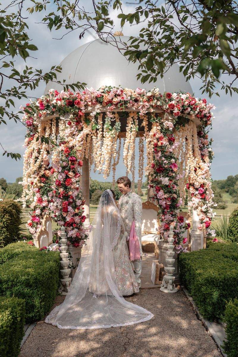 A British Groom and Gujarati Bride have a Hindu wedding under an outdoor mandap at Froyle Park in Hampshire's iconic Dome.