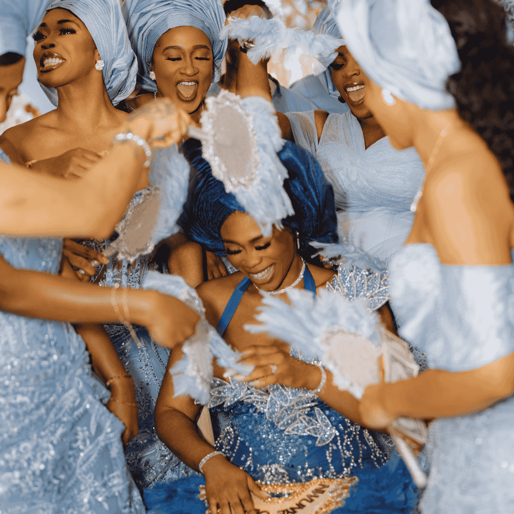 A Nigerian bride in traditional attire at her Yoruba traditional wedding at Froyle Park is showered with money