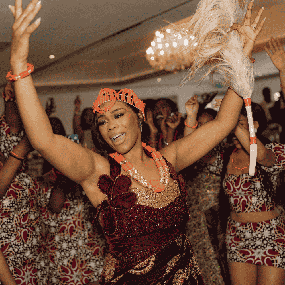 A beautiful Igbo bride celebrating her Traditional Nigerian wedding reception at Froyle Park
