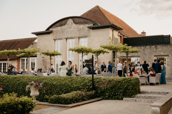 The terrace at Froyle Park features architectual parasol trees, making the space a stylish terrace for your outdoor wedding reception in Hampshire.