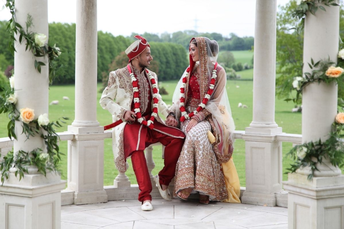 A Sikh bride and groom beneath the Dome at Froyle Park