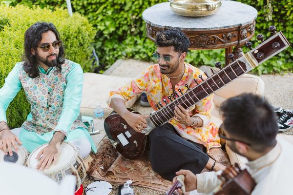 A traditional Asian band play acoustic music for a Hindu ceremony at Froyle Park