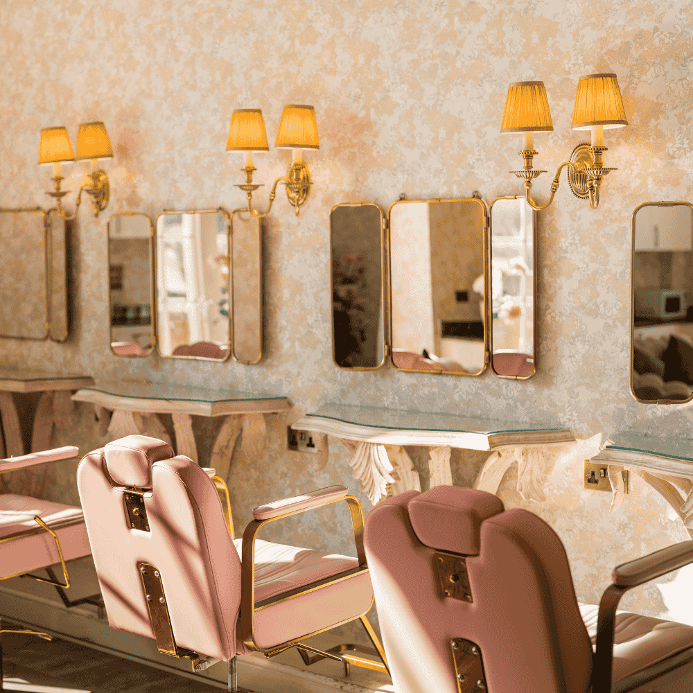 Froyle Park is a dry hire wedding venue in Surrey with amazing getting ready spaces, including our Hideaway which features pink salon chairs and designated makeup stations.