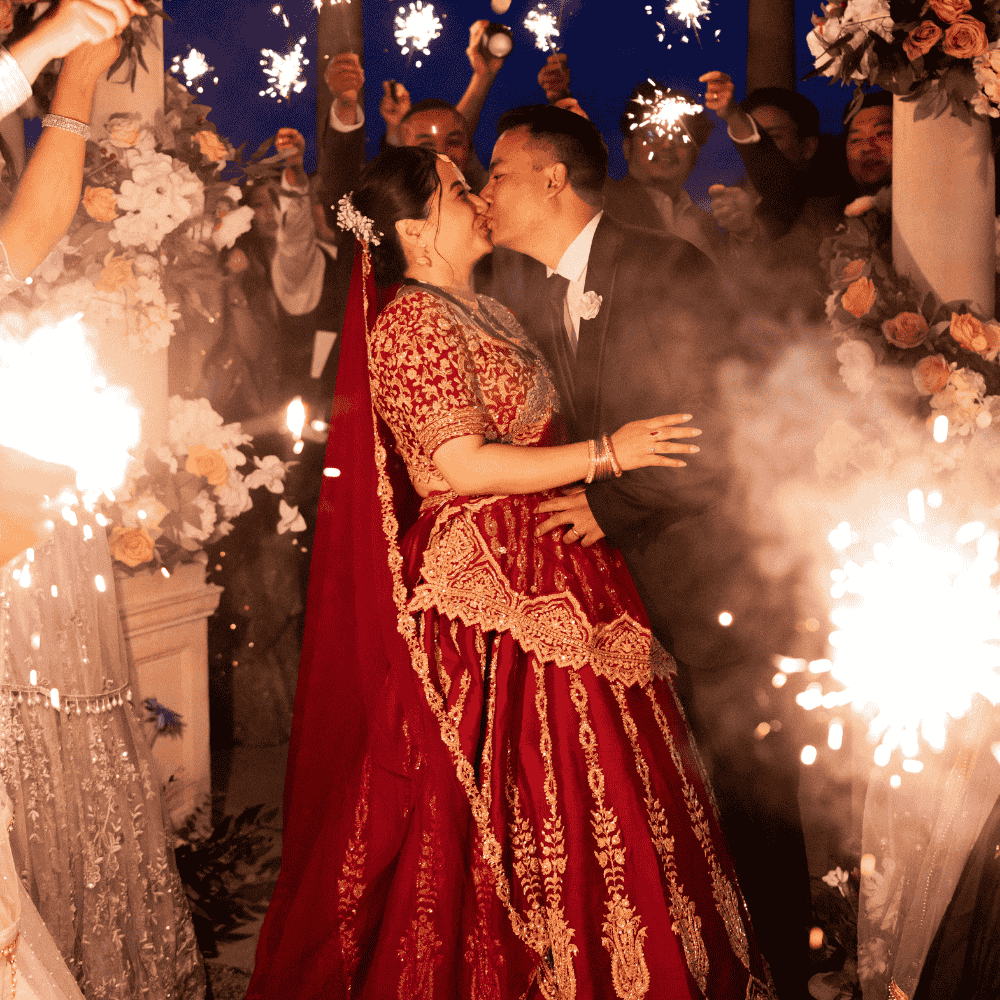 A Nepalese wedding celebrate the Bride & Groom with a sparkler display at Froyle Park - a dry hire wedding venue in Hampshire specialising in Nepalese wedding celebrations.