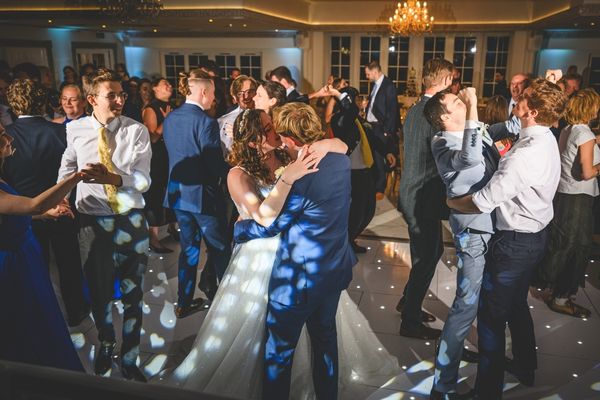 Wedding reception party inside Froyle Park in the Grand Ballroom with guests on the dancefloor