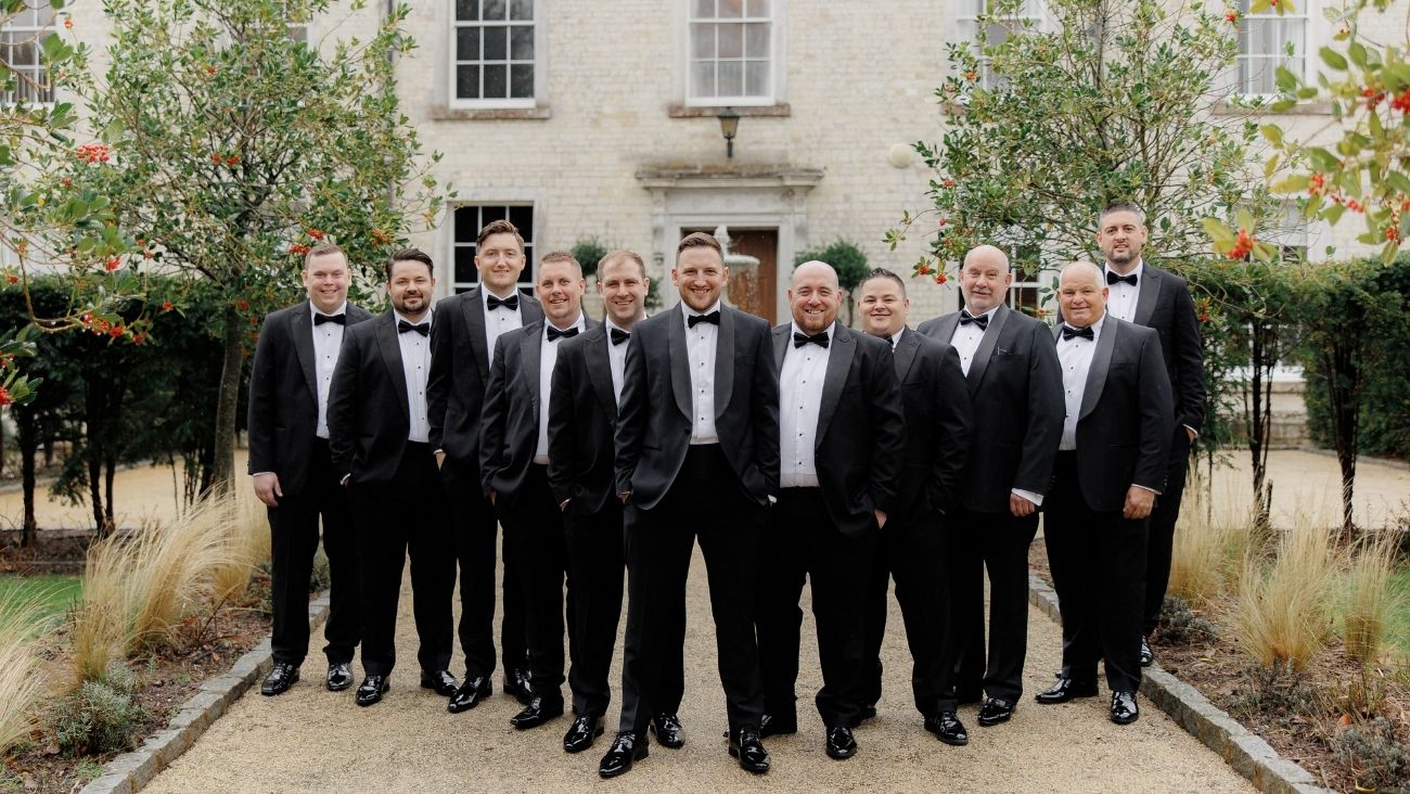Groom and ushers in smart tuxedos at Froyle Park wedding venue