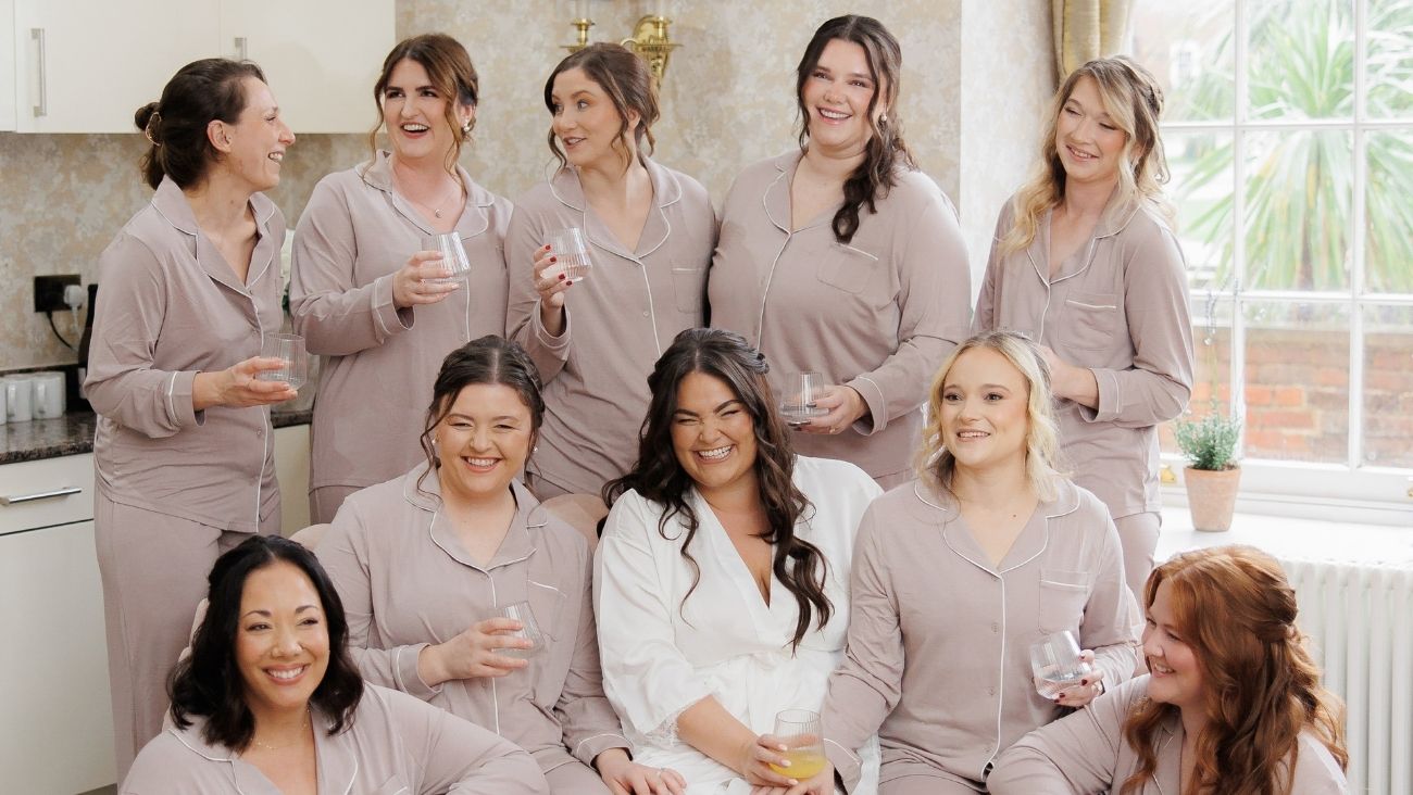 Bride and her bridesmaids in matching pjs in The Hideaway at Froyle Park