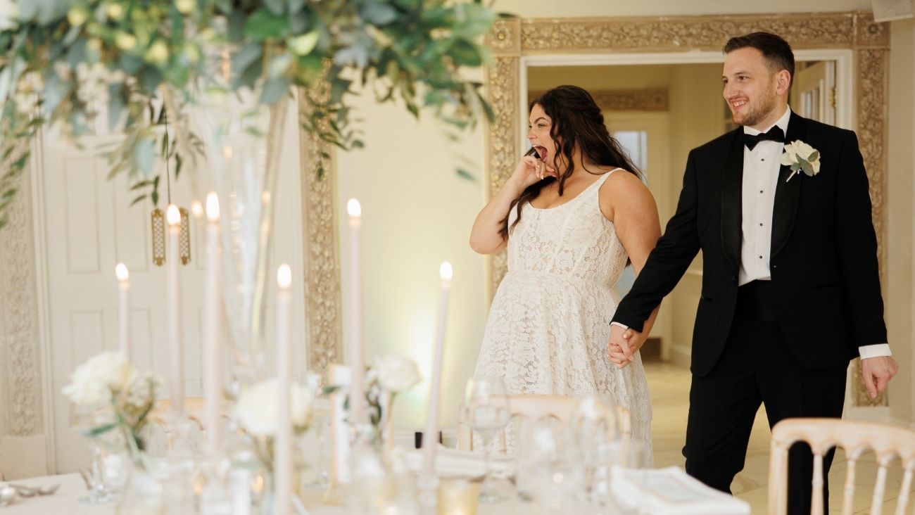 bride and groom enter the Grand Ballroom for a decor reveal for their wedding reception