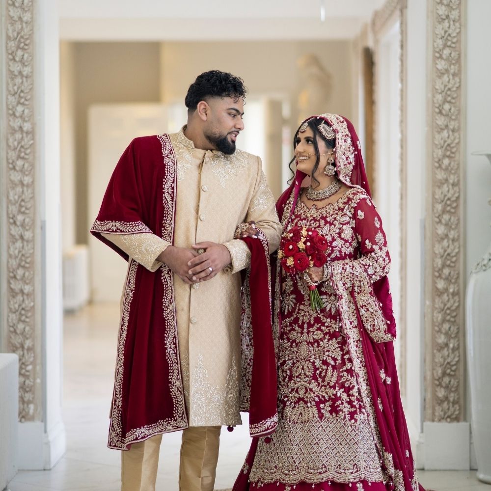 An Asian bride & groom at Froyle Park